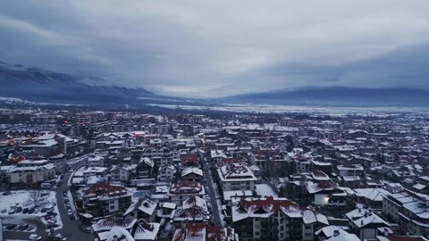 Winter evening view of a snow-covered town Bansko, Bulgaria Stock Footage 297330074