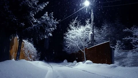 Winter evening in the village. Lantern. snowfall Stock Footage 152639622
