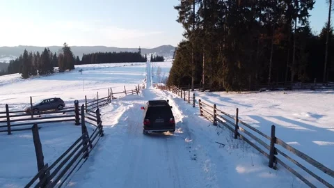 Winter Expedition: SUV Journey Through Snow-Covered Trails Stock Footage 224772416