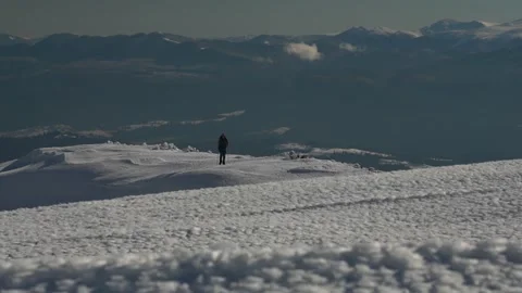 Winter Exploration on Snow-Capped Mountains at Dawn in Remote Wilderness Stock Footage 280356847