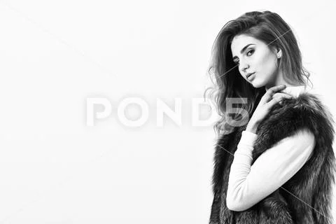 Winter fashion concept. Silver fur vest fashionable clothing. Luxury furry Stock Photos