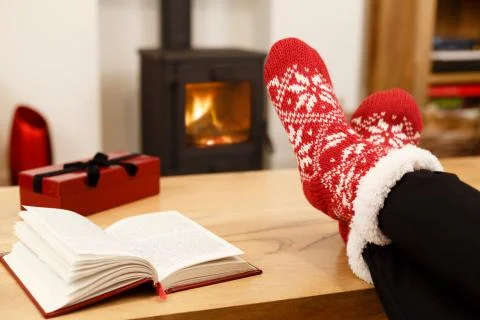 Winter feet in front of fire Stock Photos