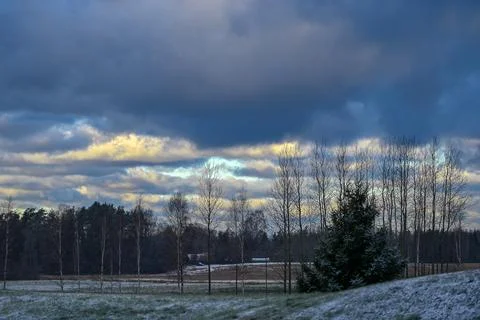 Winter Fields Beneath Heavy Blue Clouds Stock Photos