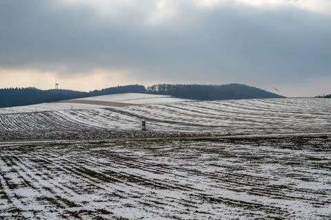 Winter Fields Under a Cloudy Sky Stock Photos