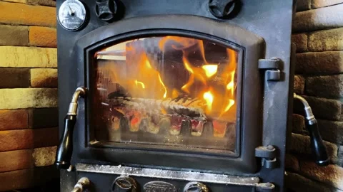 Winter Fireplace Warmth: Fixed Shot of a Stylish Burning Stove Video stock 297184616
