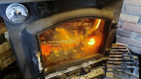 Winter Fireplace Warmth: Fixed Shot of a Stylish Burning Stove Stock Footage 297184774