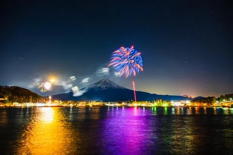Winter Fireworks Exploding Over Lake Kawaguchi and Mt. Fuji Stock Photos