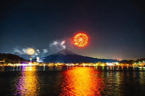 Winter Fireworks Exploding Over Lake Kawaguchi and Mt. Fuji Stock Photos