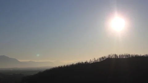 Winter flat land with vineyard and village in front and mountains on the back Stock Footage 112051771