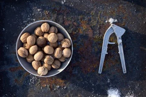 Winter flat lay with  walnut,   Nutcracker  on iron background Foto stock