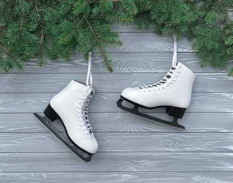 Winter flatlay with white skates for figure skating, fir branches with Christ Foto stock