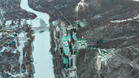 Winter flight over the Holy Dormition Svyatogorsk Lavra. Lots of churches Video stock 169604516
