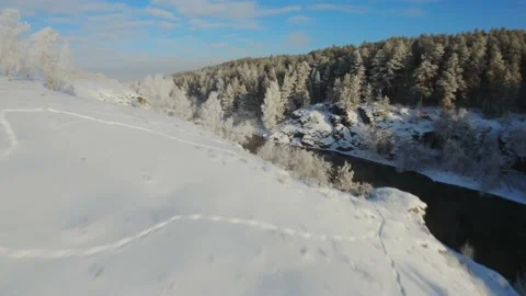 Winter flight over river from water comes steam Stock Footage 169909840