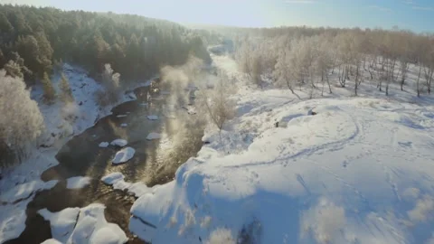 Winter flight over river from water comes steam Video stock 169909935