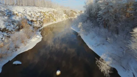 Winter flight over river from water comes steam Stock Footage 169910008