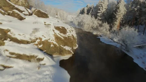 Winter flight over river from water comes steam Stock Footage 170681528