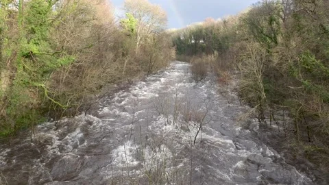 Winter flood water on the River Dee, released from Tongland Dam, Scotland Stock Footage 148040881