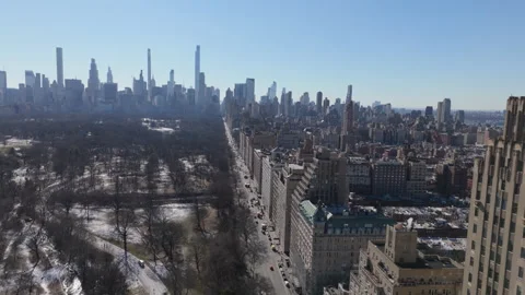 Winter flying backwards north along Central Park West in NYC Stock Footage 300222664