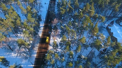 Winter forest and road in the snow from a bird's eye view. Stock Footage 104289933