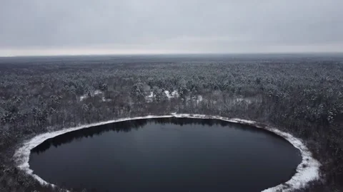 Winter forest and round lake snow Video stock 227934208