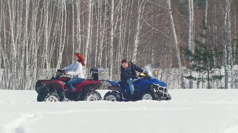 A winter forest. Cold weather. A man fixing the problem with snowmobile and Stock Footage 106885583