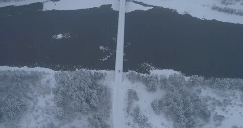 Winter forest crossing over the river Biya, Altai, on top of the drone, 4k Stock Footage 108027143