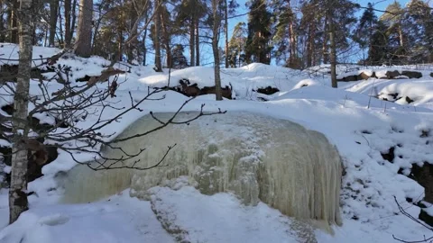 Winter in the forest. Frozen waterfall Video stock 331426054
