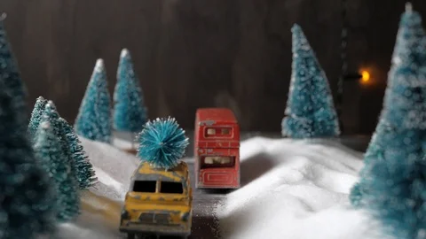 Winter forest miniature with a small yellow toy car with a Christmas tree on the Video stock 116544674