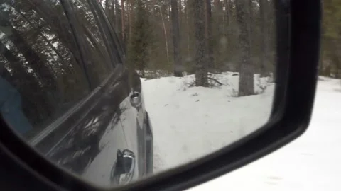Winter forest reflection in the side rearview mirror of the car. Stock Footage 150315735