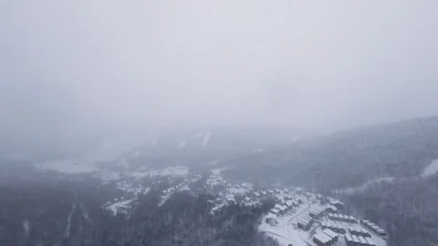Winter fpv flyover of snow-covered forest valley Stock Footage 321251488