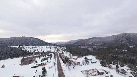 Winter fpv glide along mountain riverbank Stock Footage 321178571