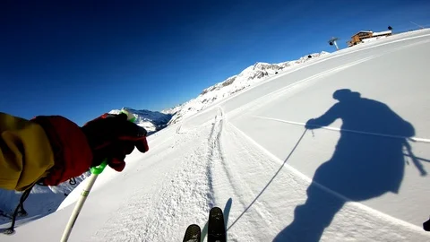 Winter freeride skiing in powder fresh snow in alps on sunny day gopro chest Stock Footage 101011408