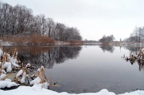 Winter on the frozen river Stock Photos