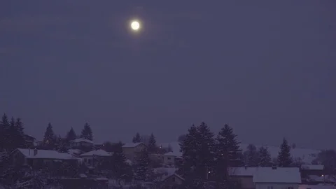 Winter Full Moon over Snowy Village 4K Stock Footage 71775634