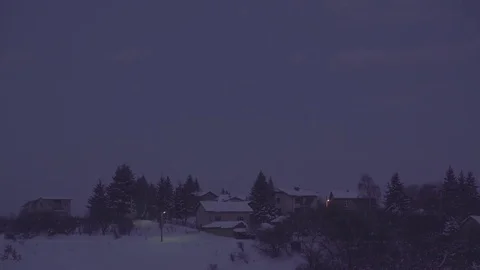 Winter Full Moon over Snowy Village Pan 4K Stock Footage 71776792