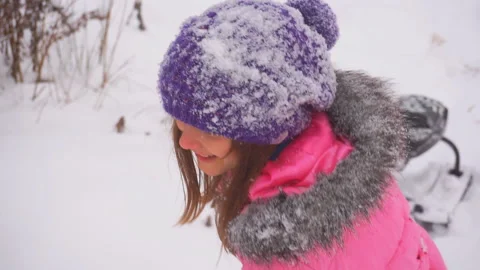 Winter fun. The girl pulls the sled up the hill. Stock Footage 99834513