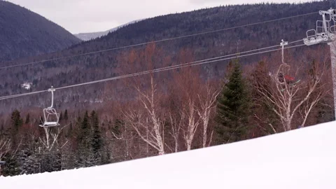 Winter fun shot of skiers riding ski lift in mountains during pandemic Stock Footage 147331153