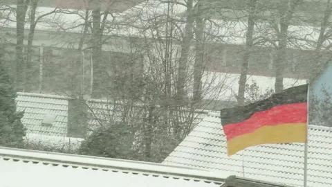 Winter in Germany. German flag under snowfall. Heating season Stock Footage 282003104