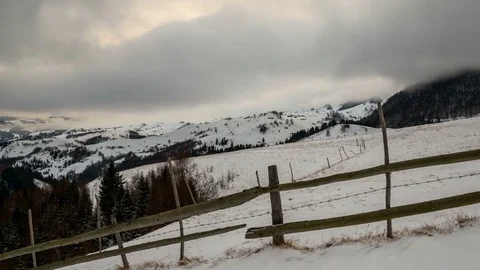Winter grey clouds over remote village in Rucar-Bran Corridor. Stock Footage 79554623