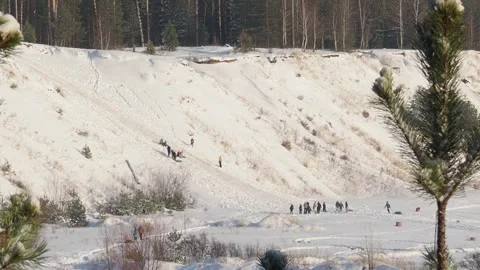 In winter, a group of people slide down the mountain on skis Stock Footage 147380759