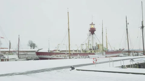 Winter Harbor Scene with Ice and Ship Stock Footage 332671664