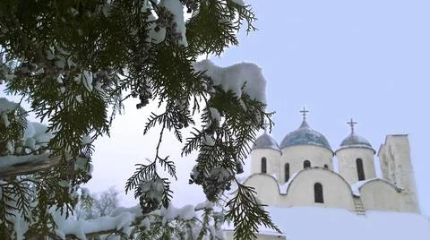 Winter is here. Tree snow covered branches in foreground. Blurred Ancient Stock Photos