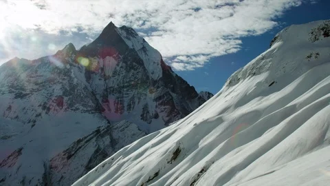 Winter high altitude mountains with cloudy sky background on sunny day Video stock 121575451