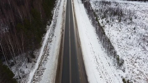 Winter highway in the woods.Drone Vídeos de archivo 123797340