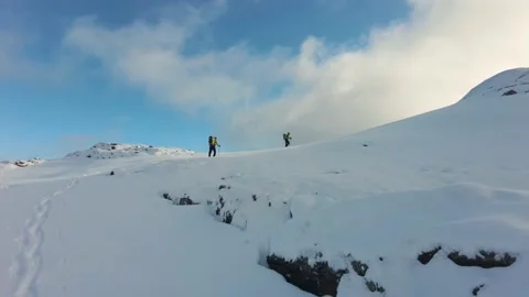 Winter Hiking to the summit Stock Footage 166717238