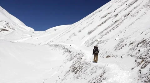 Winter hiking on a thin snowy mountain trail Video stock 67647156