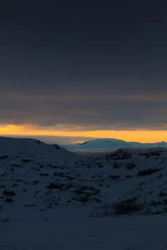 Winter hills at dramatic sunset Stock Photos