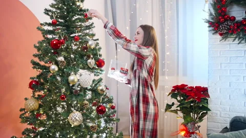 Winter holiday atmosphere at home, process of decoration spruce tree with winter 스톡 동영상 255395070