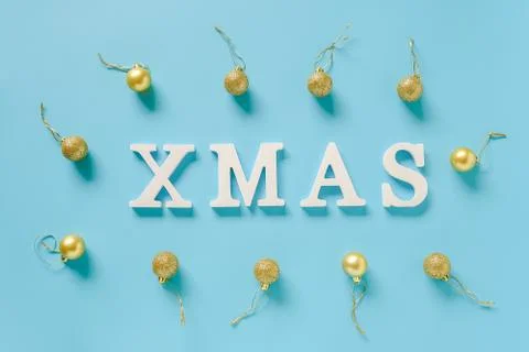 Winter holiday composition. Text Xmas from white letters and christmas decora Stock Photos