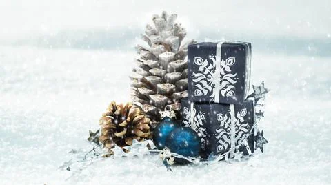 Winter Holiday Decor with Pine Cones and Gift Boxes Stock Photos